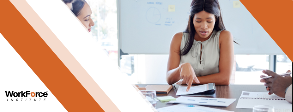 Business professional giving a presentation to colleagues with a growth chart on the screen and WorkForce Institute logo on the side.